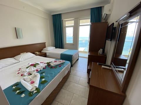 Standard Room, Sea View | Minibar, in-room safe, free WiFi, bed sheets