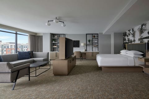 Premium bedding, desk, laptop workspace, blackout drapes