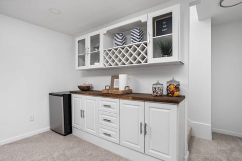 Mix drinks at our dry bar next to the game table and home theater.