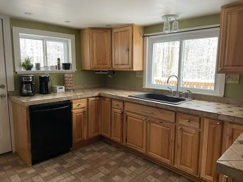 complete with high-quality cookware, a gas range, and cabinet pantry