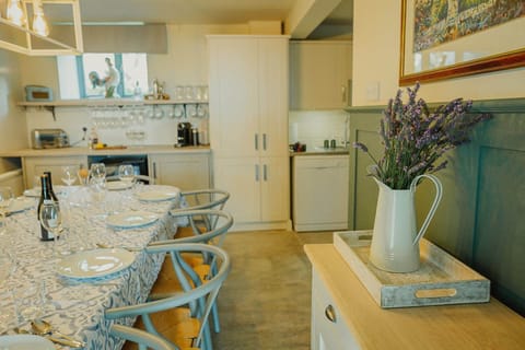 Ground floor: Open plan kitchen with oven, 4 ring hob, fridge, freezer, microwave & dishwasher