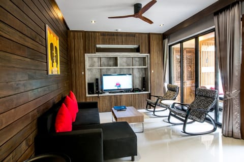 Two Bedroom Pool Residence | Living area | 32-inch Smart TV with satellite channels, books