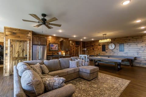 Game room with pool table, two arcade tables, XBOX, shuffleboard, and poker table. Extra refrigerator also available so you can enjoy without a separate trip to the kitchen!