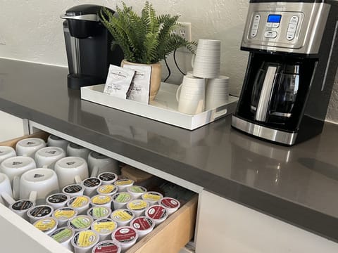 When modern meets minimalist—dome homes never disappoint! Our coffee and tea bar provides you with multi flavored k-pods, ground coffee packets and condiments.