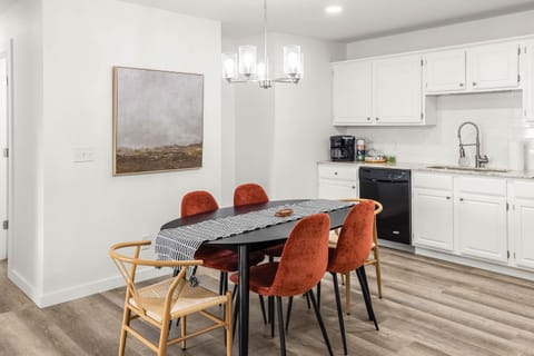 Dining table for six plus breakfast bar—ideal for sharing meals or planning your day.