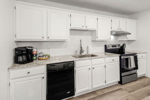 Fully stocked kitchen with stainless appliances, Keurig & drip coffee makers and plenty of counter space.