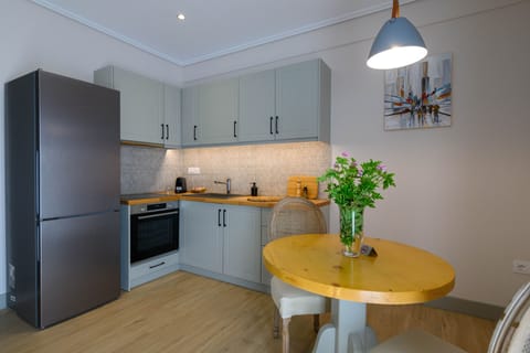 Junior Studio Suite (Mike, Ground Floor) | Private kitchen | Full-size fridge, oven, stovetop, espresso maker