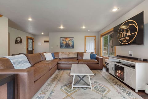 Turn on the electric fireplace for ambiance and cuddle up on the comfortable sofa.