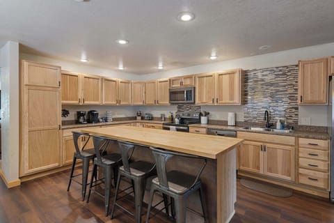 Fully stocked with dishes, cookware, utensils and seasonings.