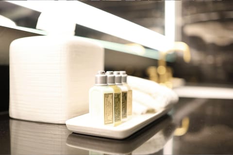 Designer toiletries, hair dryer, bathrobes, slippers