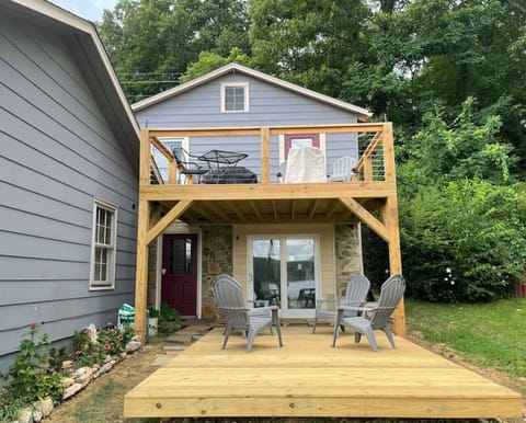 Enjoy the lake view on your private deck with seating. Firepit and gas grill present, but not in this photo.
