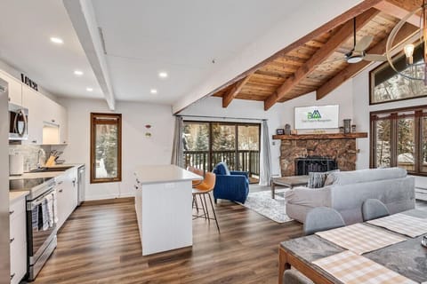 Open kitchen, living, and dining area with a clean atmosphere