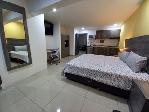 Executive Studio Suite, Kitchenette | Down comforters, desk, iron/ironing board, free WiFi