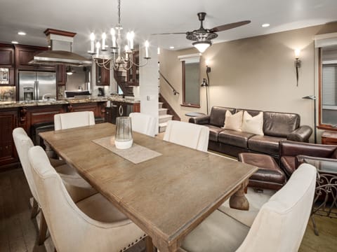 Elegant open-concept living space with cozy seating area with a leather sofa, perfect for relaxation.