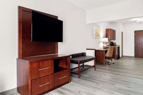 Premium bedding, desk, laptop workspace, blackout drapes