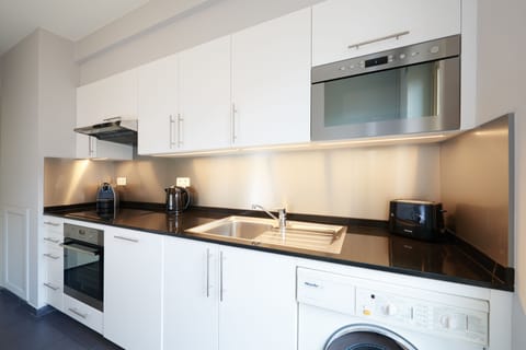 Apartment, 2 Bedrooms (Street-Court View) | Private kitchen | Fridge, microwave, oven, stovetop