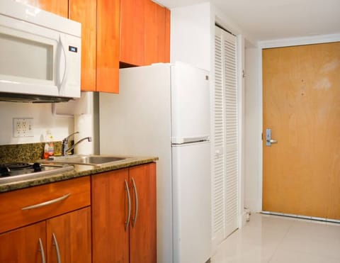 Business Condo | Private kitchenette | Full-size fridge, microwave, stovetop, toaster