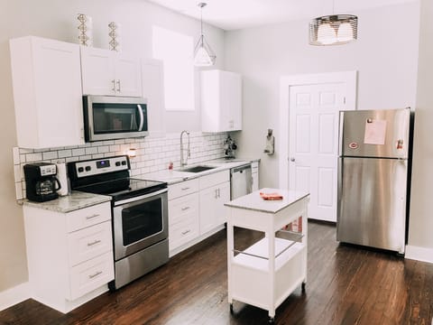 One of the upstairs kitchens. Open concept to family room in each apartment.