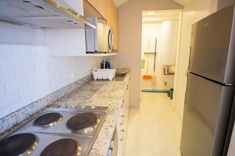 Fully equipped kitchen with appliances and utensils