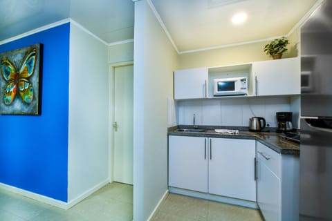 Suite, 1 Bedroom | Private kitchen | Fridge, microwave, stovetop, coffee/tea maker