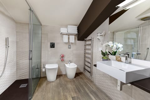 Family Room | Bathroom | Hair dryer, slippers, bidet