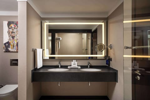 Junior Suite | Bathroom | Separate tub and shower, rainfall showerhead, designer toiletries