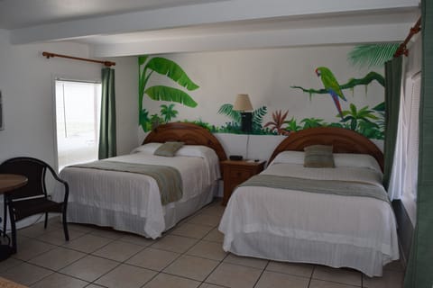 Standard Room, 2 Double Beds, Beachfront | Iron/ironing board, free WiFi, bed sheets