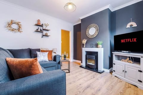 The modern living room benefits from a large corner sofa which can be converted into a double sofa bed, a 40-inch SMART TV with Netflix and plenty of space to sit down and relax.