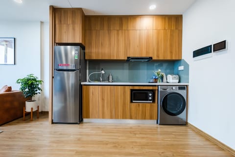 Full-size fridge, microwave, stovetop, rice cooker