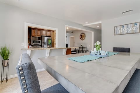 Stylish gray table, chairs, and bench—perfect for meals and gatherings.