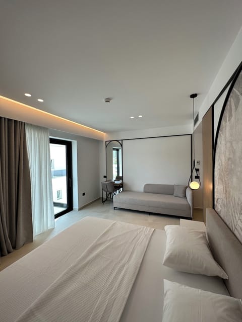 Deluxe Double Room, Balcony | Minibar, in-room safe, individually furnished, desk