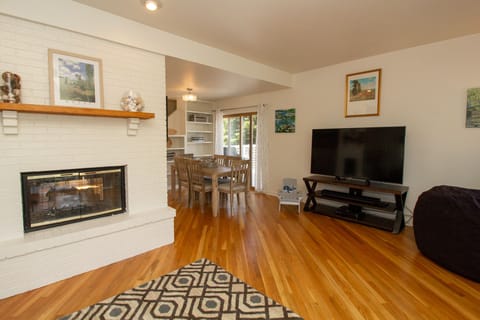 Living Room with a newly added 85" 4K TV with Sonos and surround sound!