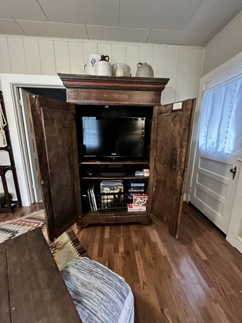 Entertainment center with games, Roku soundbar, TV and records!