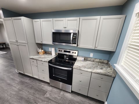 Comfort Apartment | Private kitchen | Full-size fridge, microwave, oven, stovetop