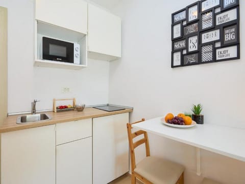 Studio (Studio Apartment with Terrace) | Private kitchenette | Fridge, electric kettle, dining tables