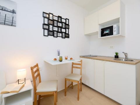 Studio (Superior Studio Apartment with Terrac) | Private kitchenette | Fridge, electric kettle, dining tables