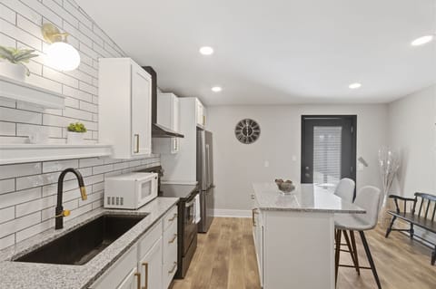 Kitchen cabinetry stocked with cooking & dining essentials