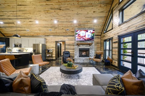 Unwind fireside with a movie, a game, or a nap—this cozy corner was made for lazy evenings.