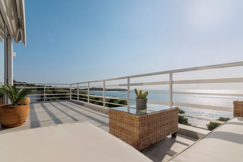 Outside lounge area and balcony with sea views