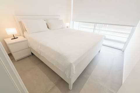 Bedroom with Queen-sized bed and balcony