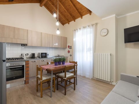 Property, Furniture, Cabinetry, Table, Countertop, Wood, Kitchen Appliance, Interior Design, Kitchen Stove, Building