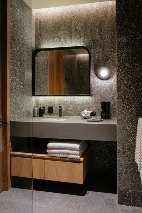 Deluxe Studio | Bathroom | Shower, rainfall showerhead, designer toiletries, towels