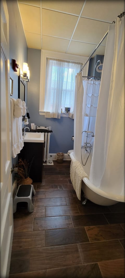 The Bates Bobcat Family Suite with Bobcat Den | Bathroom | Designer toiletries, hair dryer, bathrobes, slippers
