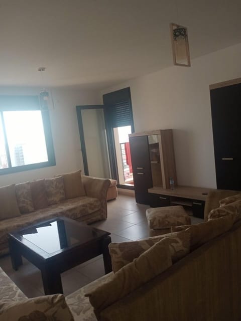 Comfort Apartment | Living area | 50-inch LED TV with satellite channels