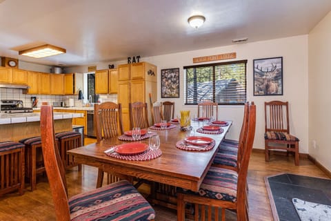 Large dining table with seating for 10 plus 3 more at the island.