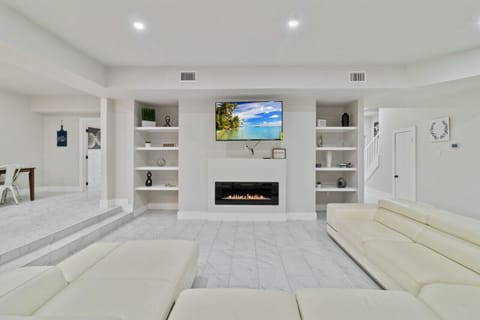 Large Wrap around Couch w/ 55 inch Smart TV