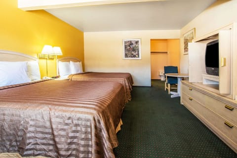 Room, 2 Queen Beds, Non Smoking, Pool View | In-room safe, desk, free cribs/infant beds, rollaway beds