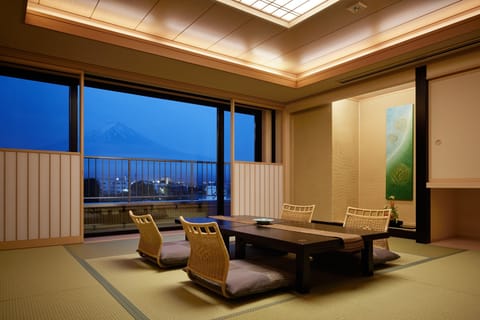 Japanese Western Style Deluxe Room with Open Air Bath, Mountain View | Living room | Flat-screen TV
