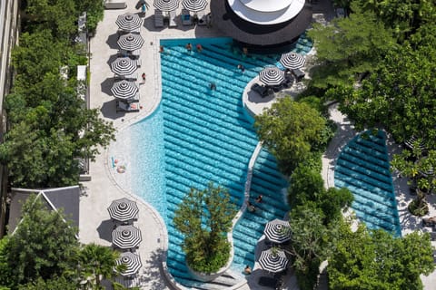 Outdoor pool, open 7:00 AM to 7:00 PM, free cabanas, pool umbrellas