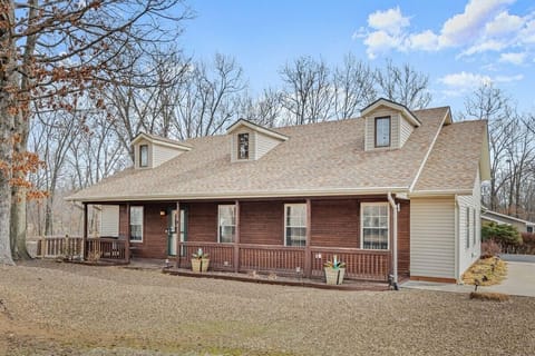 Charming brick home near Bamboozled Trail — your adventure basecamp with cozy porch & ample parking.